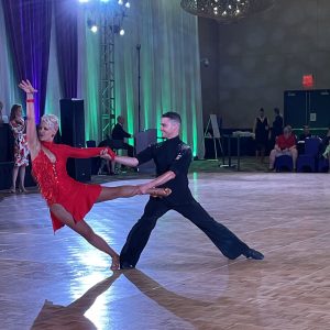 Ben and a student, Kim, dancing at a competition
