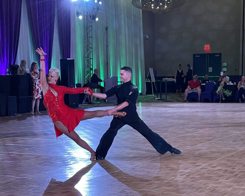 Ben and a student, Kim, dancing at a competition