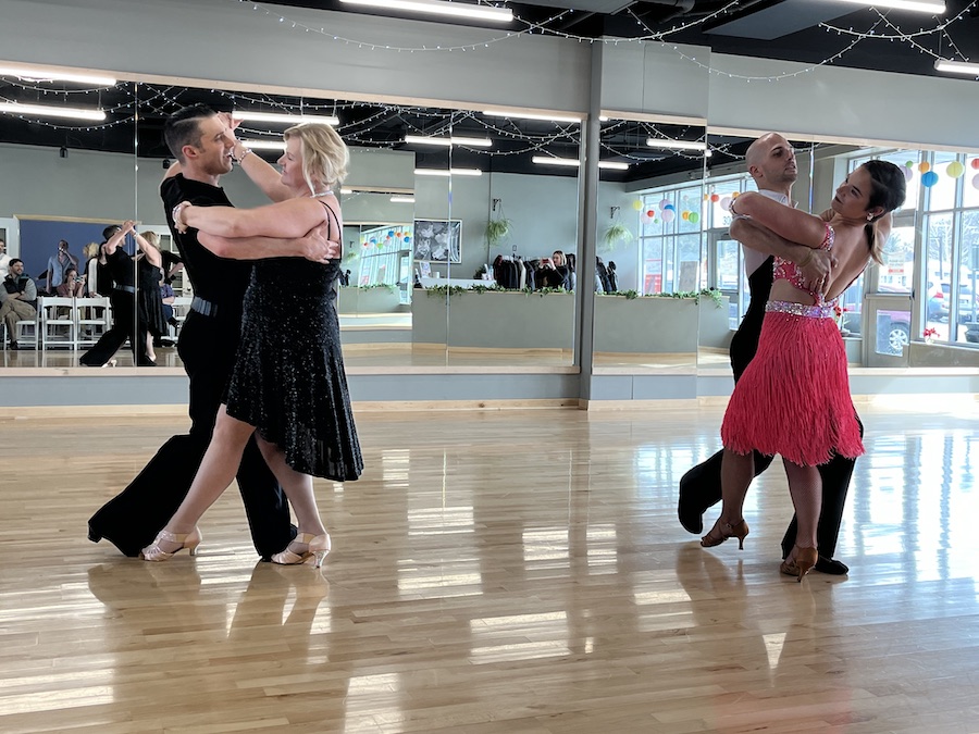 2 pairs of people dancing bolero